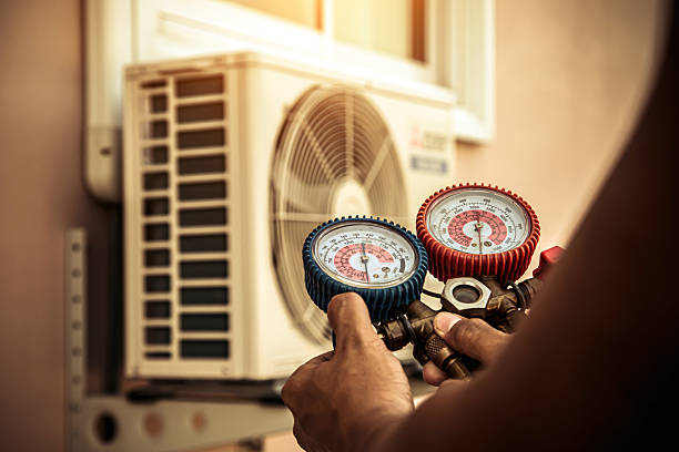 Professional Air Conditioning Service technician working in Port Jefferson Station, NY